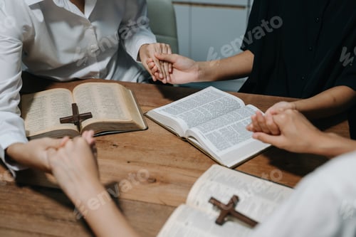 Preview: People reading and study bible in home and pray together.Studying the Word Of God