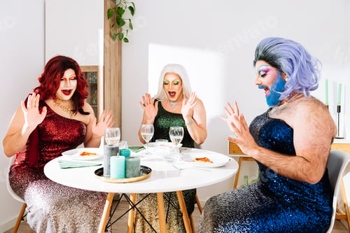 Vista previa: Excited transgender women sitting at served table