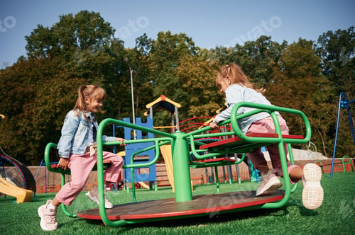 Preview: Autumn season. Kids are having fun on the playground