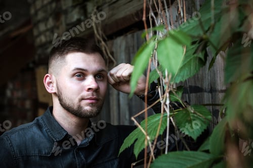 Preview: portrait of a Young man in a shirt and trousers