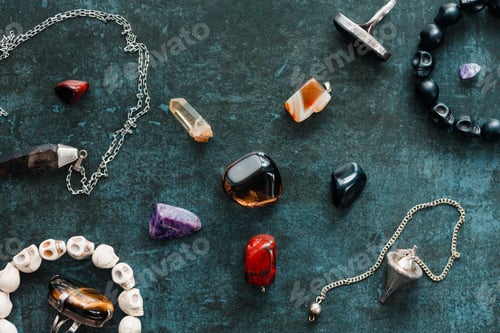 Preview: Magic flat lay. Various precious and semiprecious stones on a blue background for witchcraft.