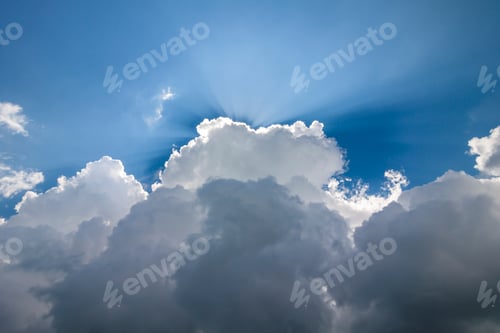 Preview: Blue sky with puffy white clouds in bright clear sunny day
