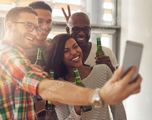 Preview: Cheerful team taking the�selfie with beer