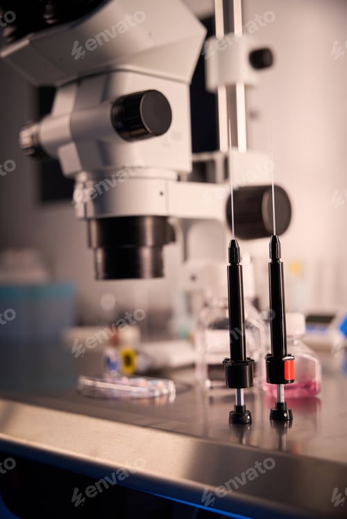 Preview: Close-up of a microscope with lab equipment in focus