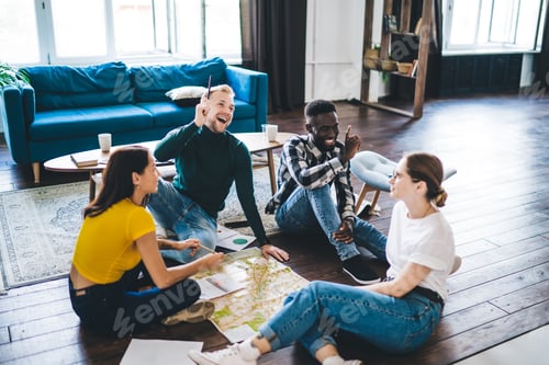 Preview: Joyful multiracial friends spending time together in cozy living room