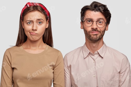 Preview: Studio shot of confused students frown faces, purse lips, cant see way out in difficult life situati