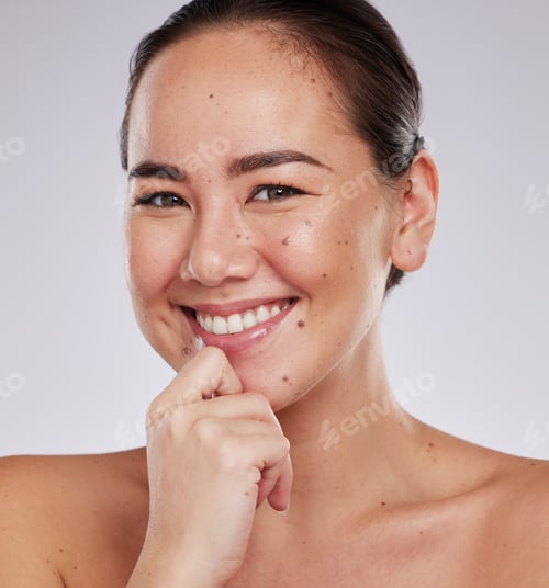 Preview: Face smile, portrait and skincare of Asian woman in studio isolated on a gray background. Makeup, b