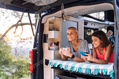 Preview: mother and daughter relaxing in their camper van