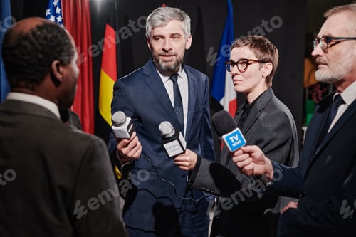 Preview: Group of journalists taking an interview