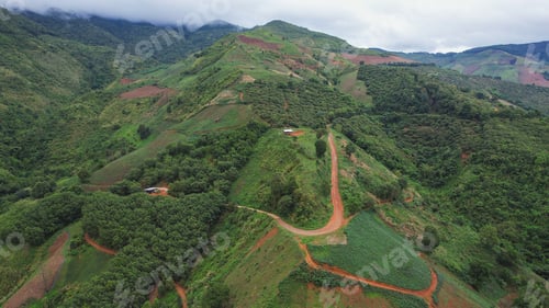 Preview: Aerial view from drone of rural village and mountain road