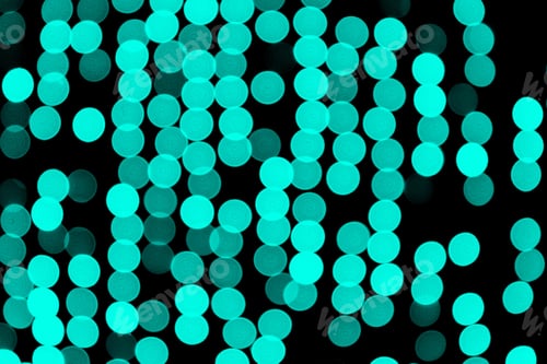 Preview: Unfocused abstract colourful bokeh black background. defocused and blurred many round blue light