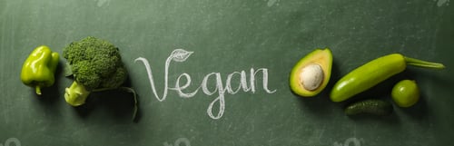 Preview: Set of protein vegetables and word Vegan on green background, top view