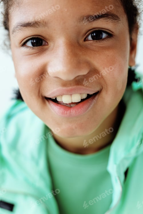 Preview: joyful young boy poses with confidence in front of clean background