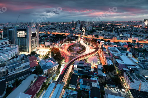 Preview: Cityscape of Victory Monument with car traffic on roundabout road at Bangkok, Thailand