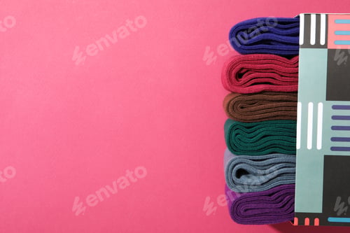 Preview: Box with socks on pink background, space for text