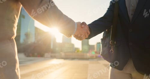 Preview: Teamwork, closeup or business people shaking hands in city for project agreement or b2b deal. Hirin