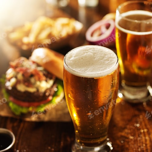 Preview: beer and burgers on wooden table