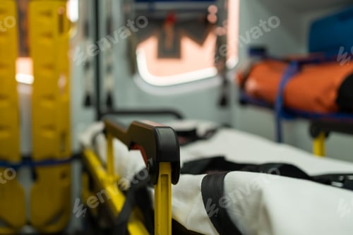 Preview: Empty stretcher waiting for patient inside ambulance vehicle
