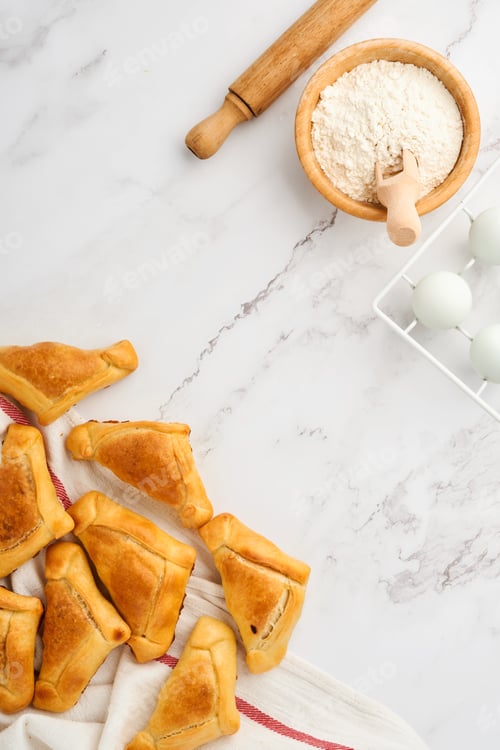 Preview: Fried empanadas with cilantro, meat, egg, tomato and chili sauce on white background. Latin American