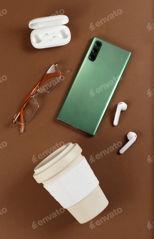 Preview: Smartphone, reusable coffee to go cup, wireless earphones and glasses