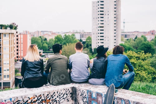 Preview: group of multiethnic friends sitting looking over