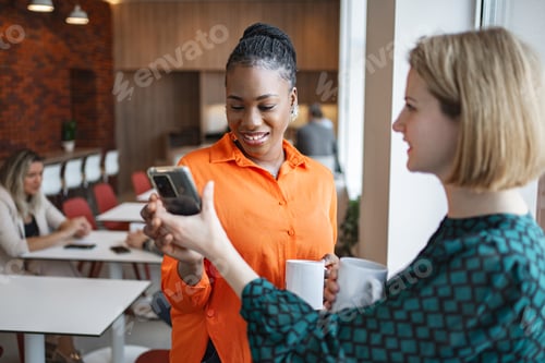 Preview: Woman Holding Cell Phone and Coffee