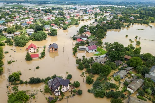 Preview: Aerial view of flooded houses with dirty water of Dnister river in Halych town, western Ukraine.