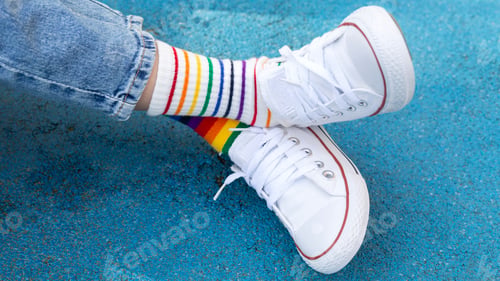 Preview: Odd Socks Day. a child in sneakers and mismatched socks