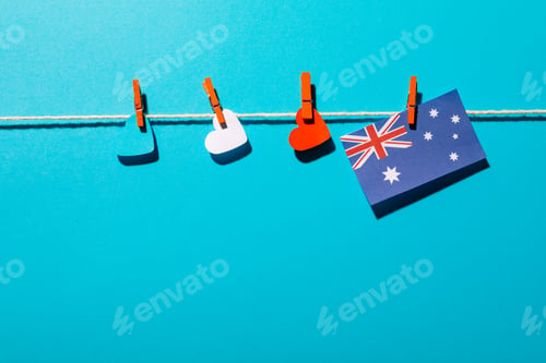 Preview: Heart shapes and australia flag hanging on clothesline with copy space over blue background