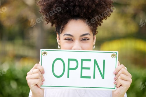 Preview: Place make a turn. Shot of a young woman holding a open outside.