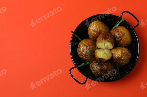 Preview: Bowl with baked potato on orange background