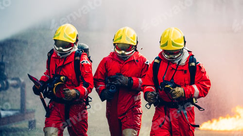 Preview: Firefighter in Full Protective Gear. Fireman Combats Intense Blaze with Life-Saving Equipment.