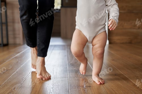 Preview: First steps of little girl at home interior