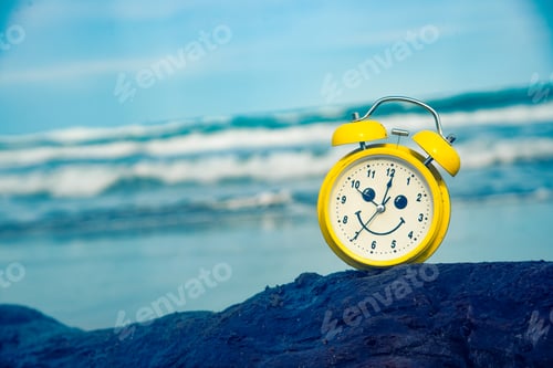 Preview: yellow clock on the beach vacation fun time
