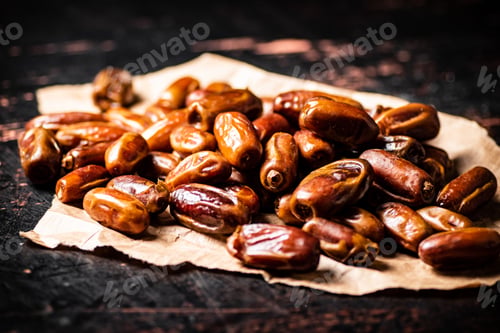 Preview: A pile of dates on paper on the table.