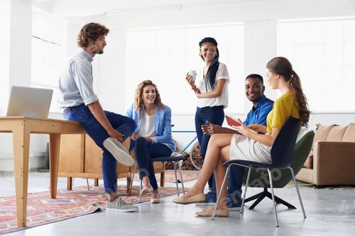 Preview: Working together for better results. Young people chatting in the office.