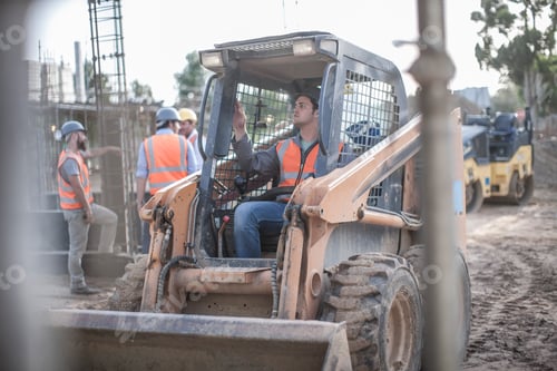 Preview: Construction worker driving excavator on construction site