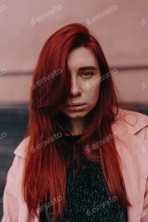 Preview: Beautiful And Stylish Girl With Red Hair Walks In The City And Her Hair Is In The Wind
