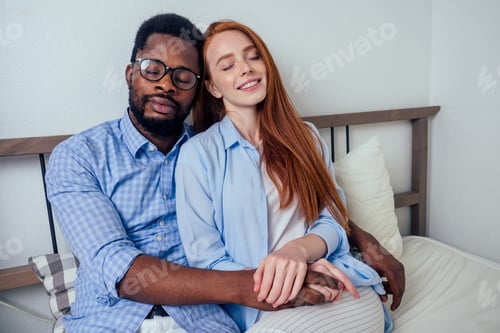 Preview: redhaired ginger caucasian happy female and multi-ethnic afro man together