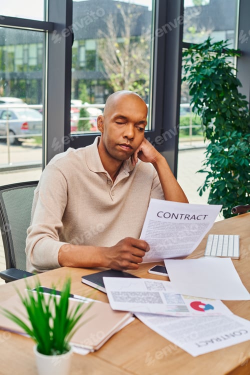 Preview: inclusion and diversity, african american man with myasthenia disease looking at contract, dark