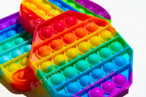 Preview: Colorful antistress pop it toy on white background