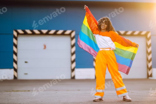 Preview: African American lesbian woman holding LGBT rainbow flag. concept freedom, love for same-sex couples