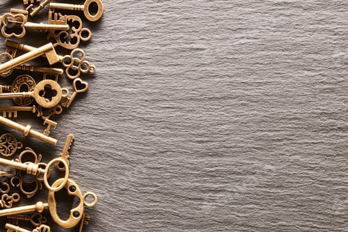 Preview: Various metal keys on slate background