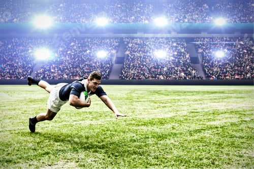 Preview: Digital composite image of rugby player jumping with the ball to score touchdown in sports stadium