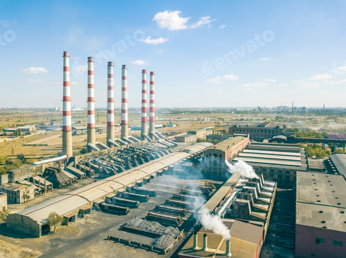 Preview: aerial view of manufacturing factory with high industrial pipes with harmful emitions