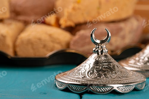 Preview: Turkish delight dessert on traditional tableware on dark blue table