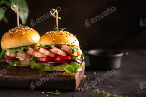Preview: Two Shrimp Burgers on a Rustic Wooden Board