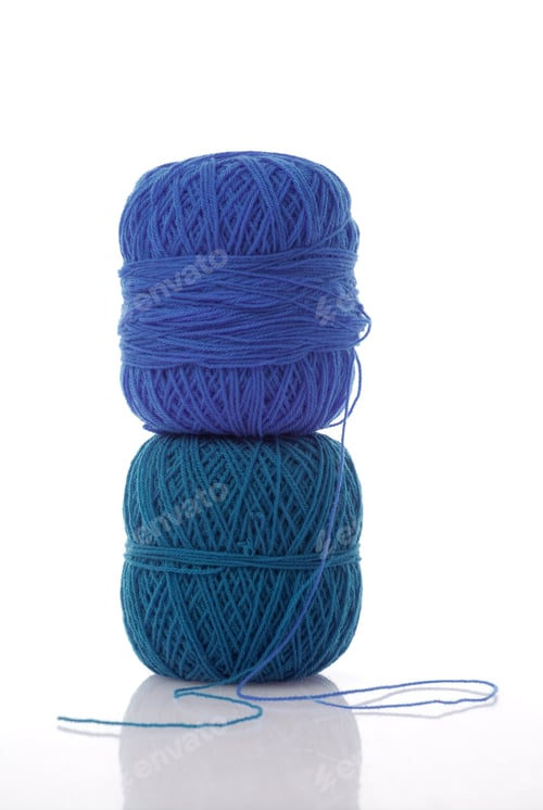 Preview: Stacked Blue and Teal Yarn Balls on White