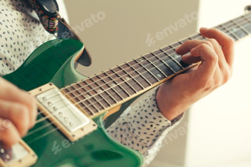 Preview: man playing electric guitar