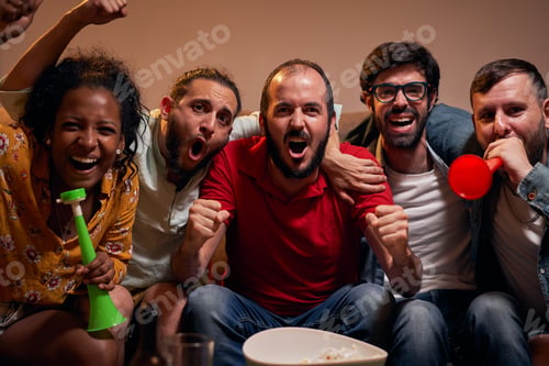 Preview: Group of Soccer Fans Relax on a Sofa, Watch a Sports Match at Home looking at camera